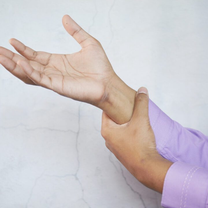 man suffering pain in hand close up .