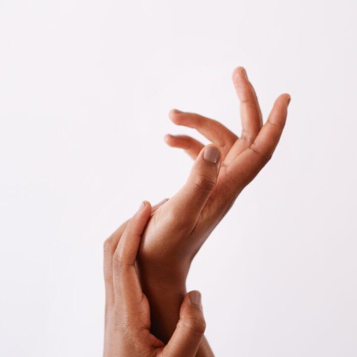 My hands feel super soft. Studio shot of an unrecognizable womans hands against a white background