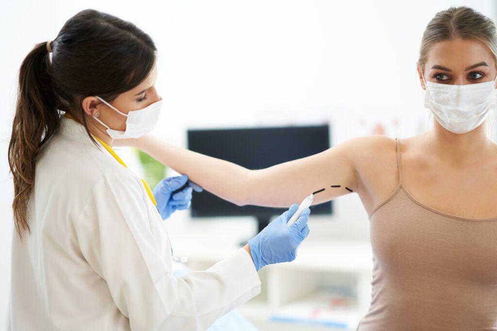Picture of plastic surgeon consulting a female patient