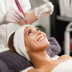 Shot of a beautiful young woman on a facial dermapen micro-needling treatment at the beauty salon.