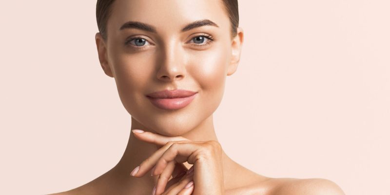 Healthy skin woman natural makeup beauty face closeup with hands